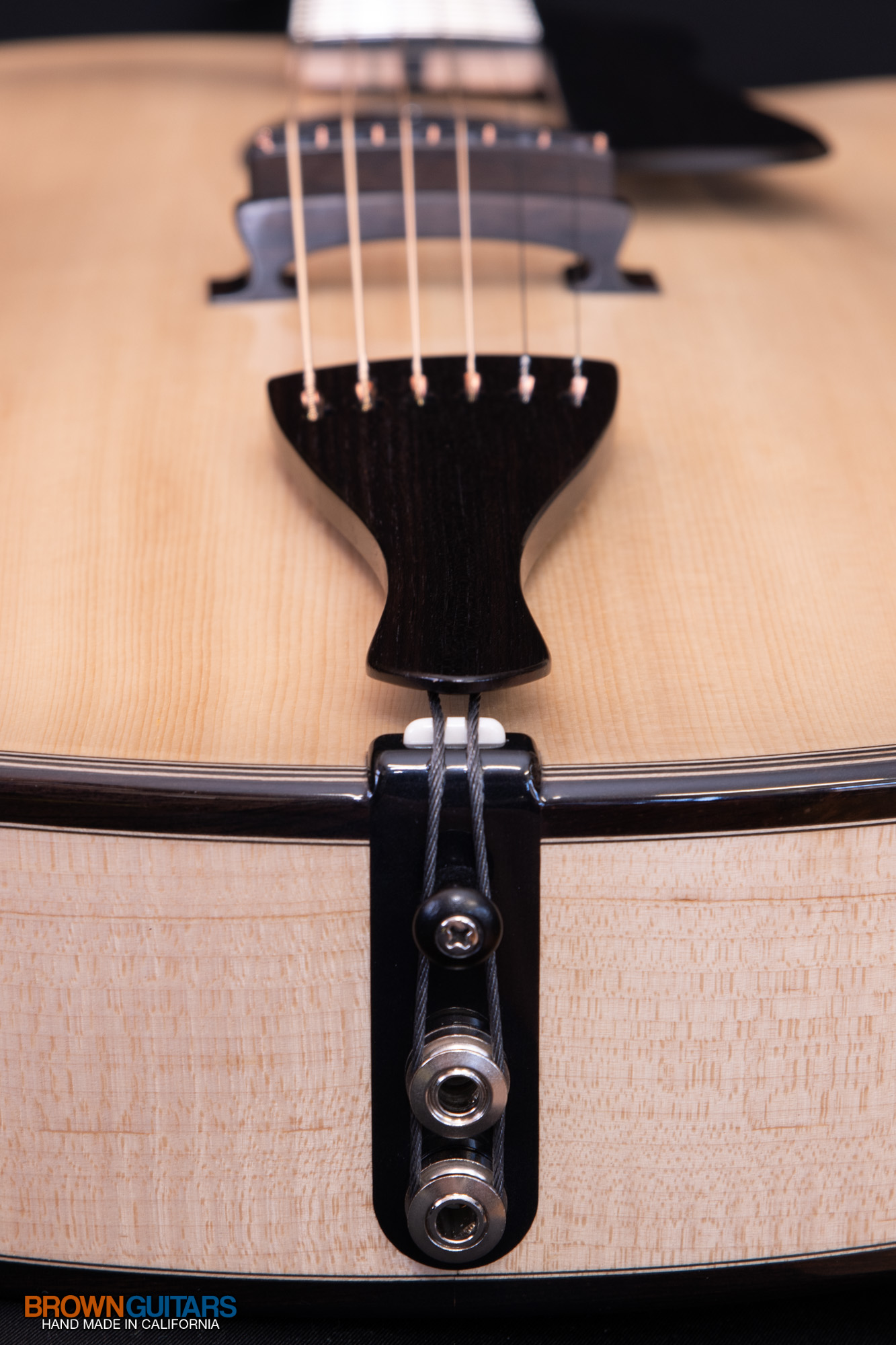 Custom archtop tailpiece with tuned string afterlengths